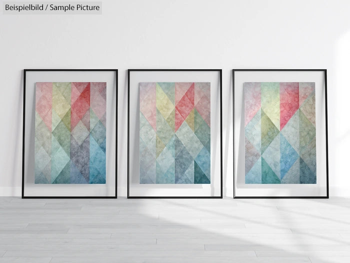 Three framed geometric abstract art pieces with colorful patterns on a white wall in a modern gallery setting.