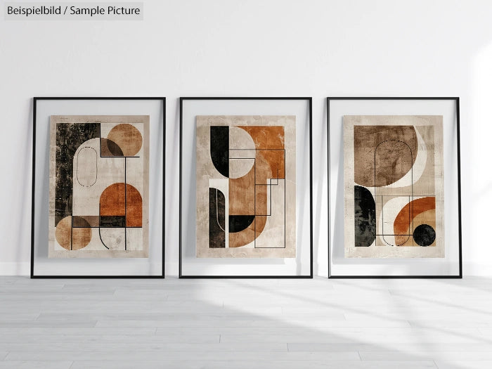 Three modern abstract art posters with geometric shapes in black, brown, and beige, framed and displayed on a white wall.