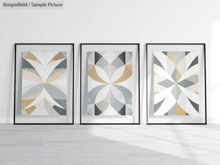 Three framed geometric abstract art prints with neutral tones on a light grey wall.