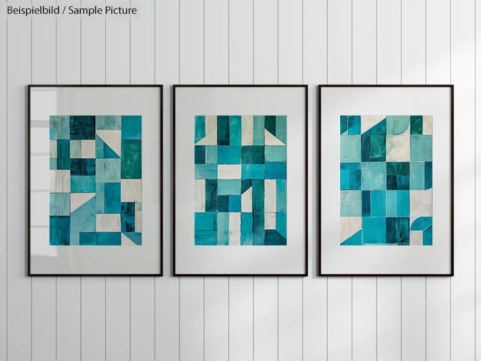 Three framed abstract teal and white geometric artworks on a wall with vertical wood panels.