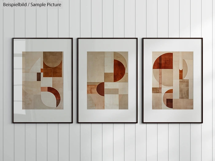 Three framed abstract geometric art prints on a white panel wall.