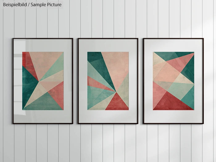 Minimalist wall art with geometric abstract designs in red, green, and beige colors, displayed in three black frames.