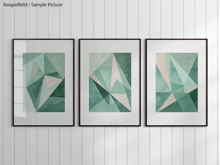 Three abstract geometric paintings in shades of green, framed on a white paneled wall.