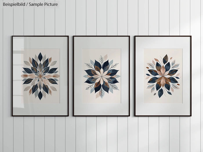 Set of three framed geometric leaf prints on a white textured wall.