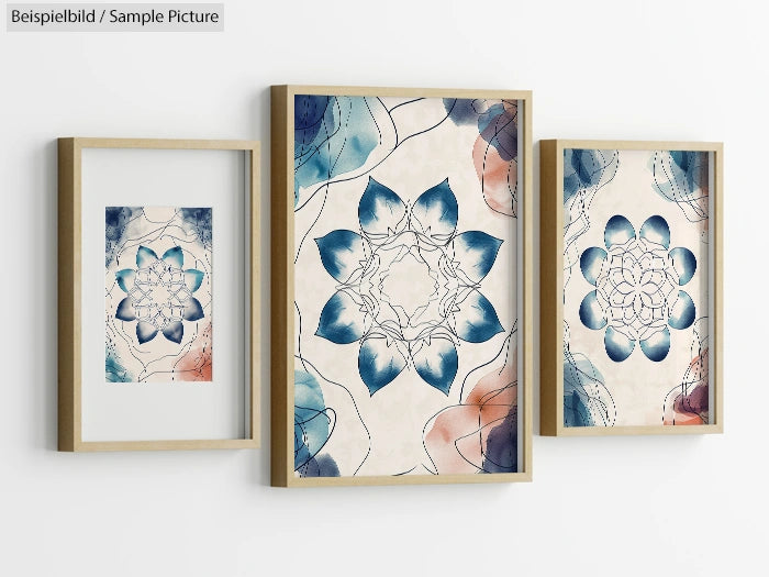 Three framed abstract floral artworks with blue and red details on a white wall.