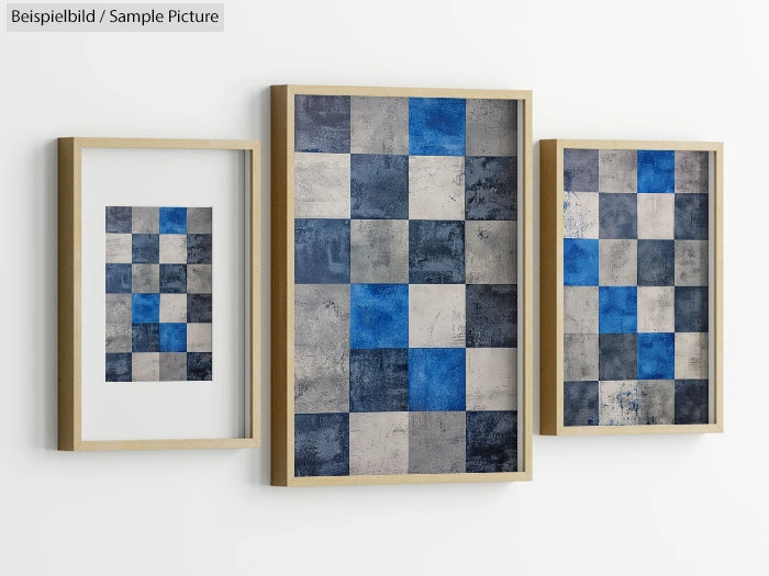 Three framed abstract checkerboard paintings with blue and gray squares on a white wall.