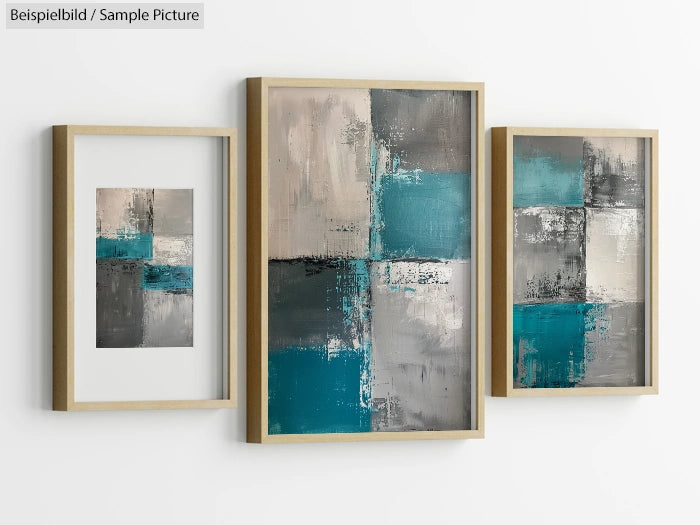 Three modern abstract paintings with teal, gray, and cream blocks in wooden frames on a white wall.