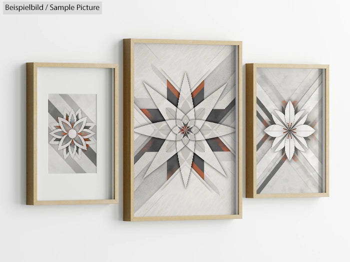 Three framed geometric artworks with star patterns in shades of gray and orange, displayed on a white wall.