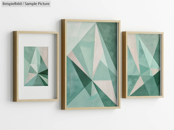 Set of geometric abstract paintings with green and teal triangles in wooden frames.