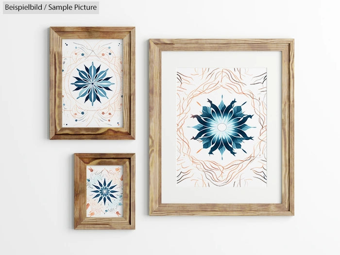 Three framed geometric floral patterns on a white wall.