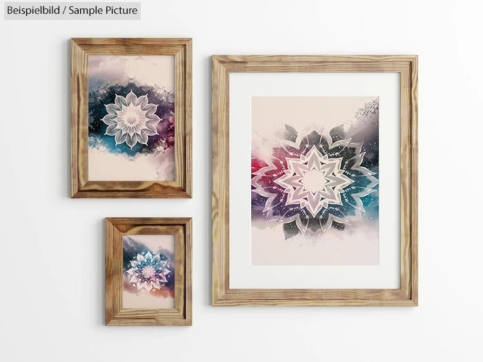 Three framed abstract geometric artworks on wall with starburst designs in wood frames.