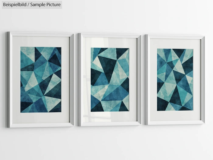 Three geometric abstract artworks in blue and teal hues, framed and hung on a white wall.