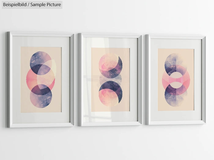 Three framed abstract art pieces with overlapping circles in pink, purple, and beige hues, on a white wall.