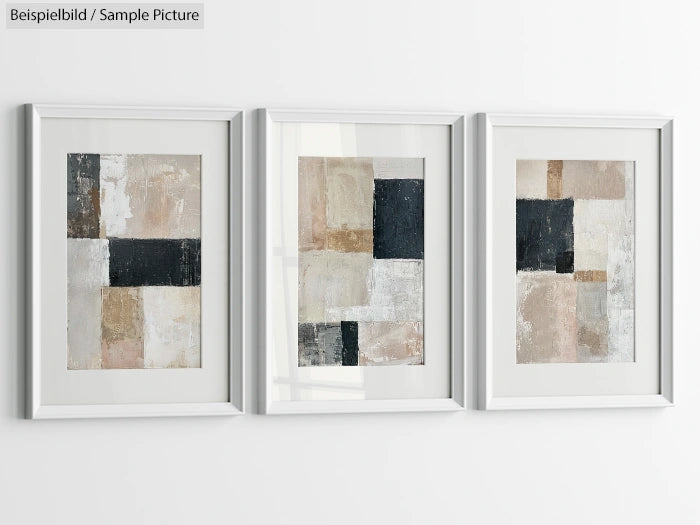 Abstract geometric art prints in a set of three, featuring muted tones of black, white, and beige, framed on white wall.