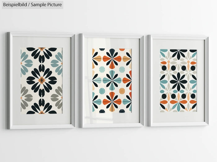 Set of three framed artworks with floral and geometric patterns in gray, blue, orange, and black hues.