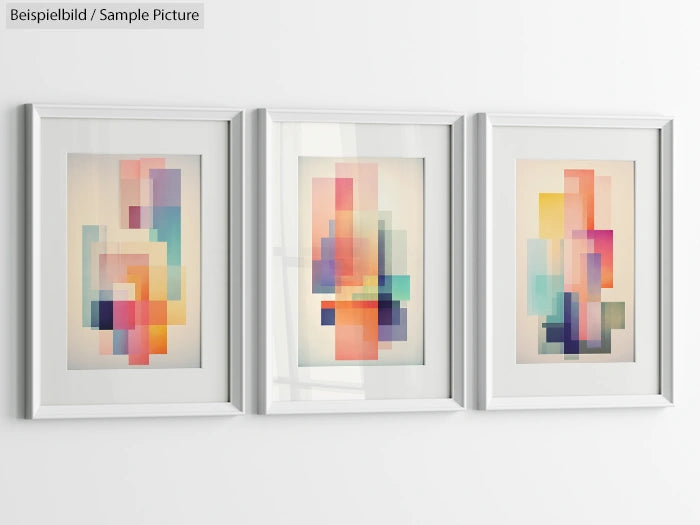 Three framed abstract art prints with colorful geometric shapes hanging on a white wall.