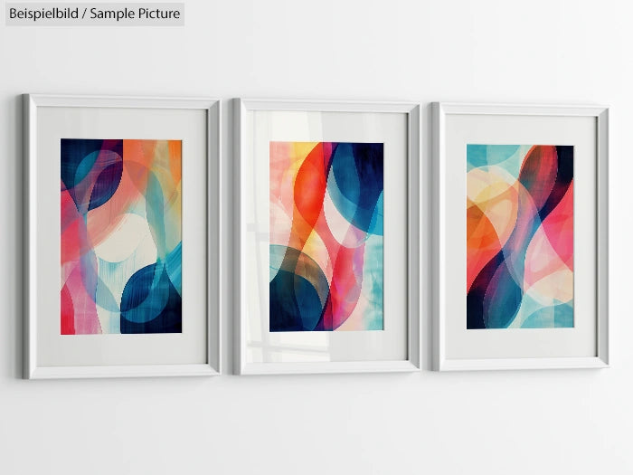 Three framed abstract paintings with colorful overlapping wave patterns on a white wall.